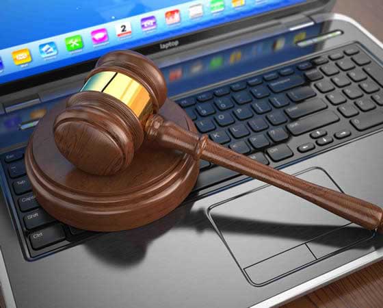 An auction gavel on a laptop keyboard