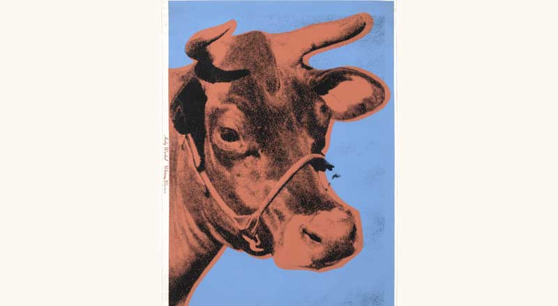 Andy Warhol’s screenprint of a cow’s head in pink and red tones against a bright blue background