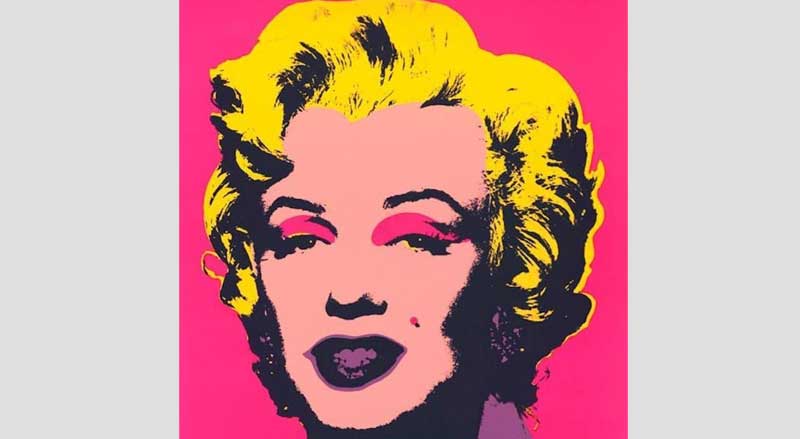 Andy Warhol Marilyn Monroe portrait print in pink and orange pop art colors.