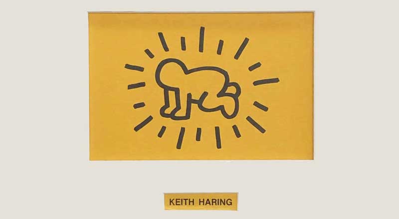 Keith Haring radiant baby artwork on yellow background, Lucio Amelio portfolio cover featuring signature bold line style.