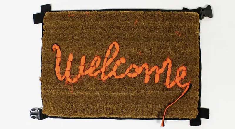 Banksy “Welcome” artwork created on a doormat using repurposed materials, reflecting street art’s transformation of everyday objects into fine art.